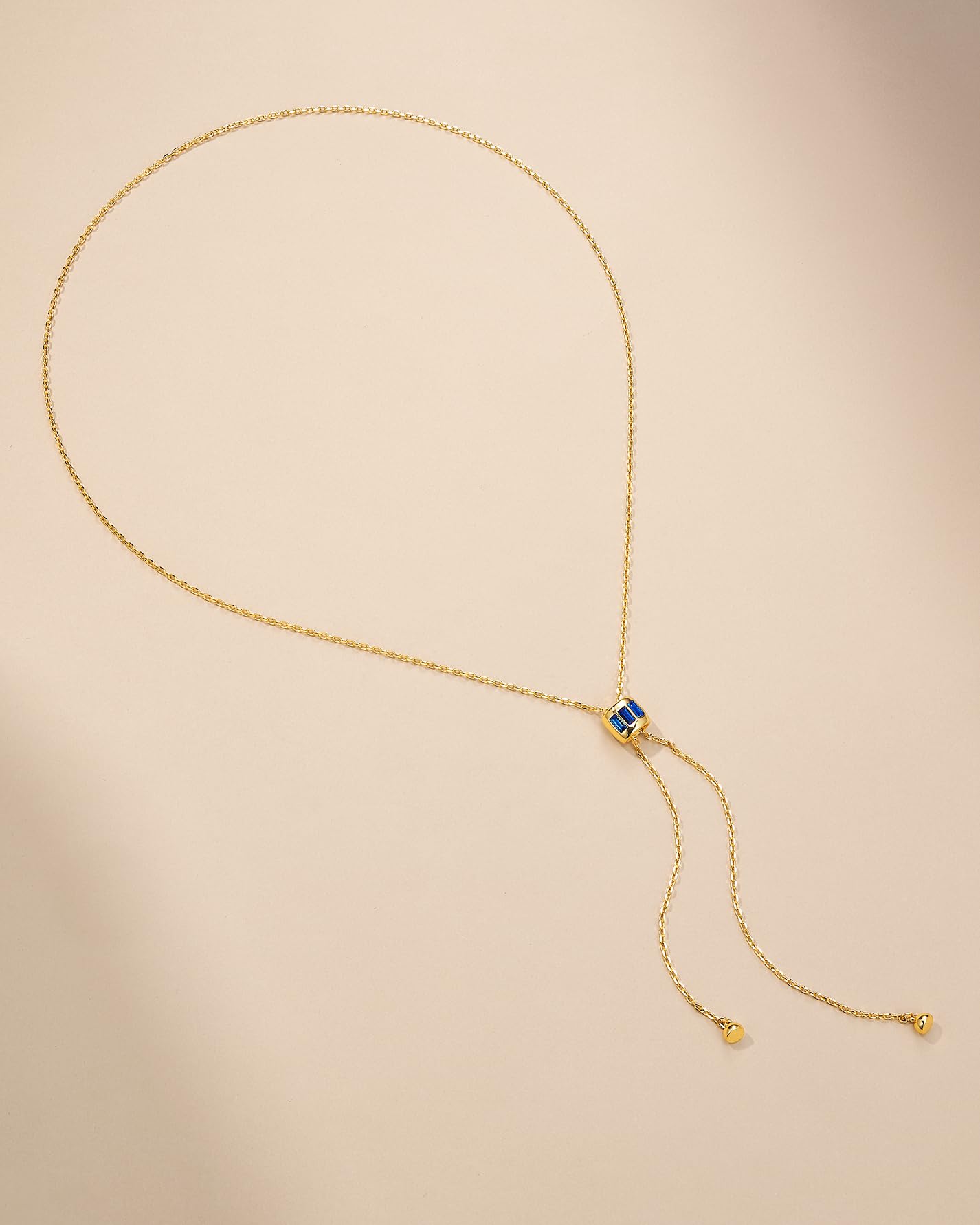 Visit the SNGIA Store Long Drop 18K Gold Plated Stacked Layered Lariat FULLY ADJUSTABLE Pull Through Blue Sapphire CZ Tassel Chain Pendant Necklace For Women by SNGIA, Dainty Trendy Gemstone Bolo Slip Sweater Statement Jewelry Gifts, Bohemian Vintage Hand