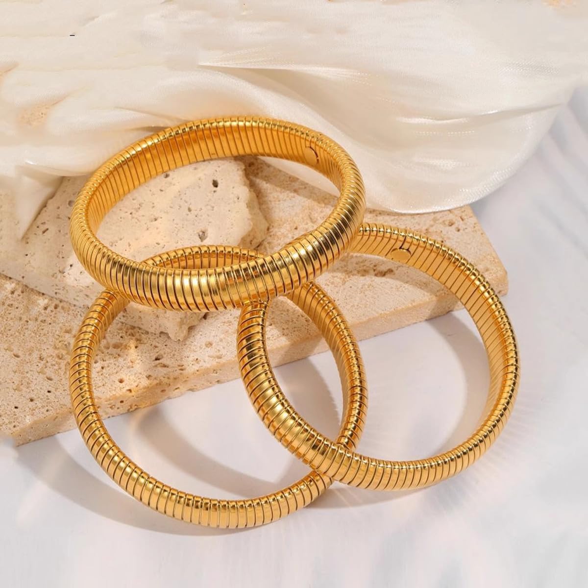 JUNYANGY Gold Bracelets for Women Set of 3 Gold Chunky Stretch Bangles Bracelets 24K Gold Plated Stainless Steel Bracelets Flexible Wide Stack Bracelets Designer Look Alike Jewelry for Women
