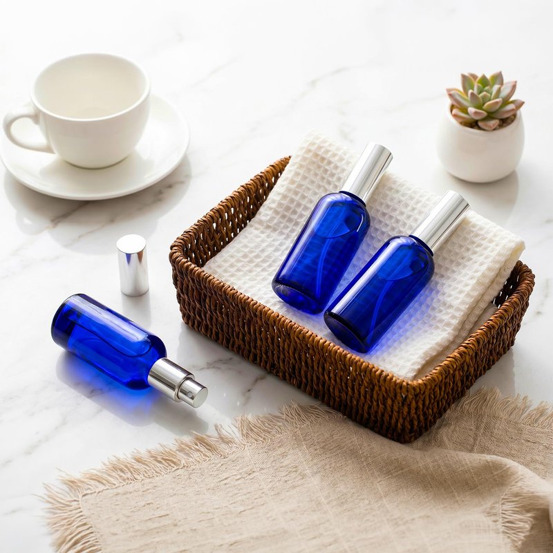 Foraineam 9 Pack 100ml / 3.4 oz. Blue Glass Spray Bottles with Atomizer Refillable Fine Mist Spray Bottle Containers for Perfume, Essential Oils, Cleaning Products