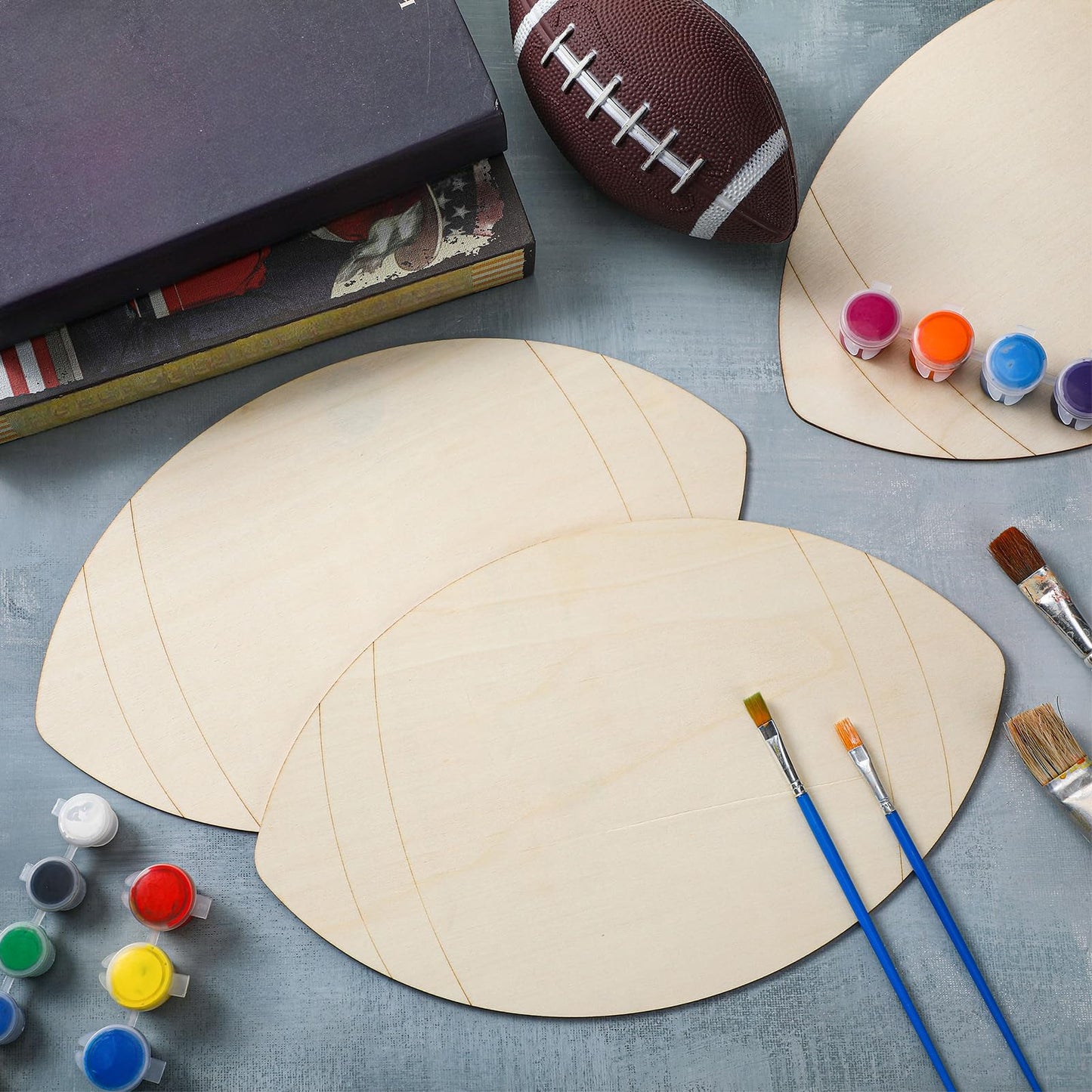 Gerrii 12 Pcs 12 Inch Wooden Football Cutouts Unfinished Wood Sports Themed Cutout Blank Wooden Football Shape Wood Hanging Slice Ornaments for DIY Craft Door Hanger Sport Themed Party Home Decoration