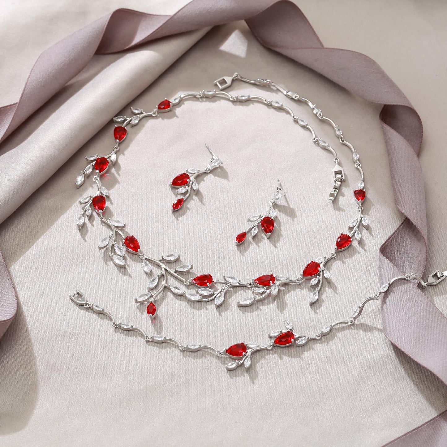 EVER FAITH Elegant Jewelry for Bride Women Bridesmaid, Sparkly Red Cubic Zirconia Pear-Shaped Birthstone Leaf Necklace Earrings Bracelet Set for Prom